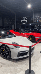 Luxury car showroom featuring Porsche, Ferrari documented in Plovdiv