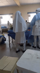 Medical staff treat patient in Maiduguri hospital room