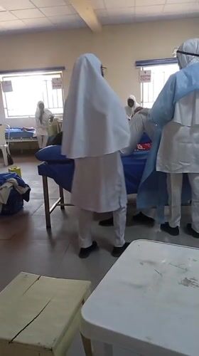 Medical staff treat patient in Maiduguri hospital room