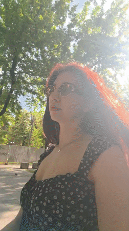 Woman strolls tree-lined promenade in Stara Zagora