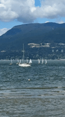 Evening waterfront scenes captured in Vancouver with sailboats, mountains