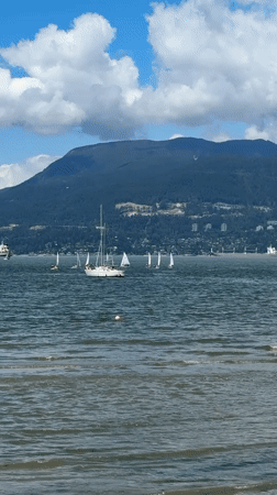 Evening waterfront scenes captured in Vancouver with sailboats, mountains