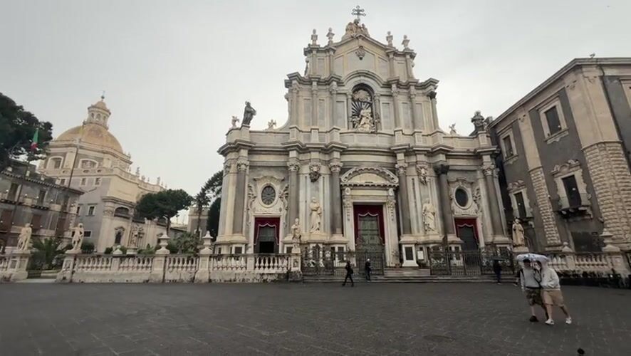 Early morning fish market operates in rainy Catania
