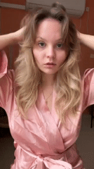 Woman in pink robe photographed in Tel Aviv