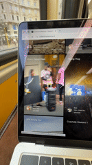 Milan commuter browses collectivememory.ai on laptop during transit