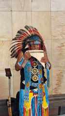 Pan flute performance in Native American regalia, central Moscow