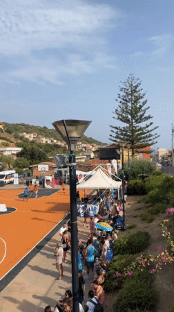 Outdoor basketball tournament and street life in Villasimius, Sardinia