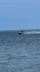 Jet skis, beach towels, and a prop plane over Ko Samui