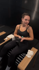 Woman poses with massage gun during photo shoot in London