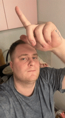 Man pours drinks in Russian home setting