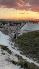 Vibrant sunset illuminates Ürgüp's unique rock formations in Turkey