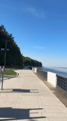 Quiet afternoon unfolds along Chaikovsky waterfront as families gather