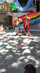 Clown performs for kids in Shymkent courtyard, rabbit in tow