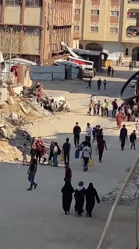 Residents navigate debris-lined streets in Khan Yunis
