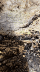 Cave exploration documented through multiple interior formations and passages