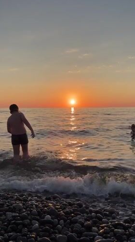 Batumi summer evening: Black Sea sunset, beachside, and city life