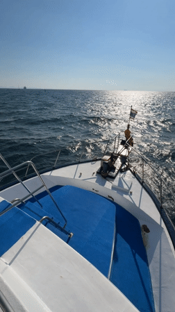 Man pilots motorboat in Thai waters near Wichit