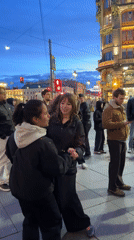 Evening street performers draw crowds near Singer House, Saint Petersburg