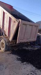 Dump truck offloads soil in Chaikovsky, Russia
