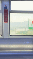 Girl watches from train window as woman boards in Yuzhong
