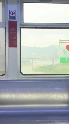 Girl watches from train window as woman boards in Yuzhong