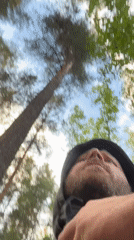Man records video message in Russian forest