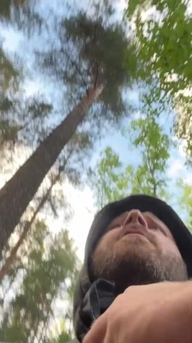 Man records video message in Russian forest