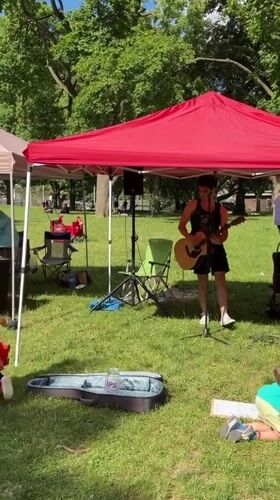 Live music and stilt performer entertain at Toronto park event