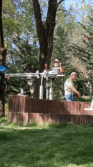 Man exercises in lakeside park in Tirana