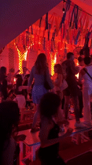 North Kuta nightclub packed and dancing under red streamer lights