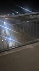 Nighttime traffic observed from pedestrian bridge in Kuchingoro, Nigeria