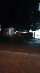Night ride past a fashion store and Pertamina gas station
