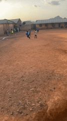 Daily life unfolds in Bukuru Nigeria marketplace and streets