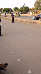 Young Men Practice Rollerblading Tricks on Jos Street