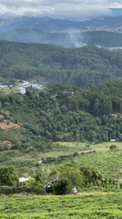 Witness documents mountainous Vietnam landscape with wind turbines, settlements