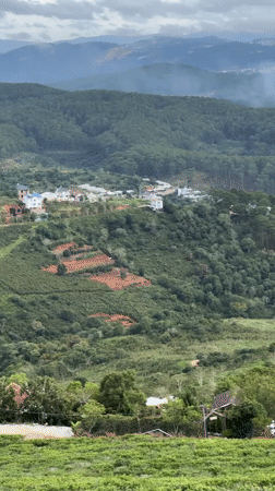 Witness documents mountainous Vietnam landscape with wind turbines, settlements