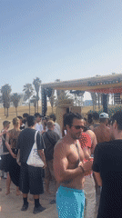 Summer festival energy at Barceloneta beach on a June afternoon