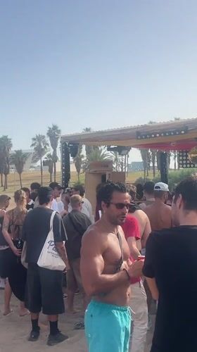 Summer festival energy at Barceloneta beach on a June afternoon