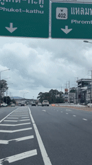 Motorcycle rider travels highway in Ratsada, Thailand