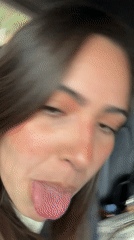 Woman makes playful faces while in car in Mexico