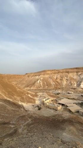 Desert landscape with buildings filmed near Arad, Israel