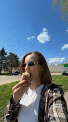 Woman enjoys ice cream outing with baby in Reshetnikovo