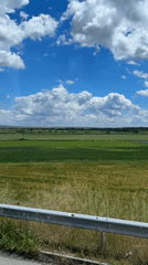 Traveler photographs scenic Bulgarian landscape from moving vehicle window
