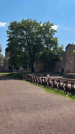 Tourist visits ancient Roman ruins in Tivoli, Italy