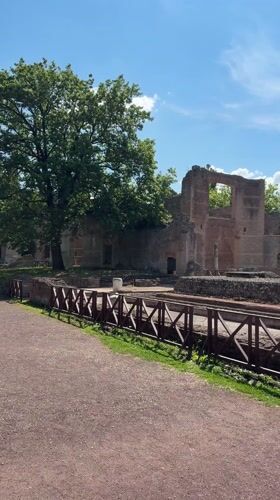 Tourist visits ancient Roman ruins in Tivoli, Italy
