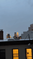 NYC skyline captured from rooftop during twilight hours