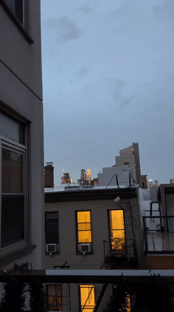 NYC skyline captured from rooftop during twilight hours