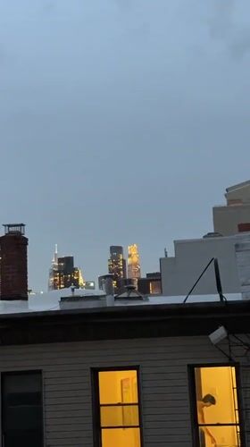NYC skyline captured from rooftop during twilight hours