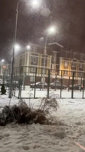 Nighttime snow scene captured in Korolyov residential area