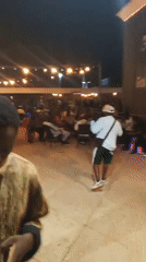 Nighttime social gathering with live music in Adankolo, Nigeria